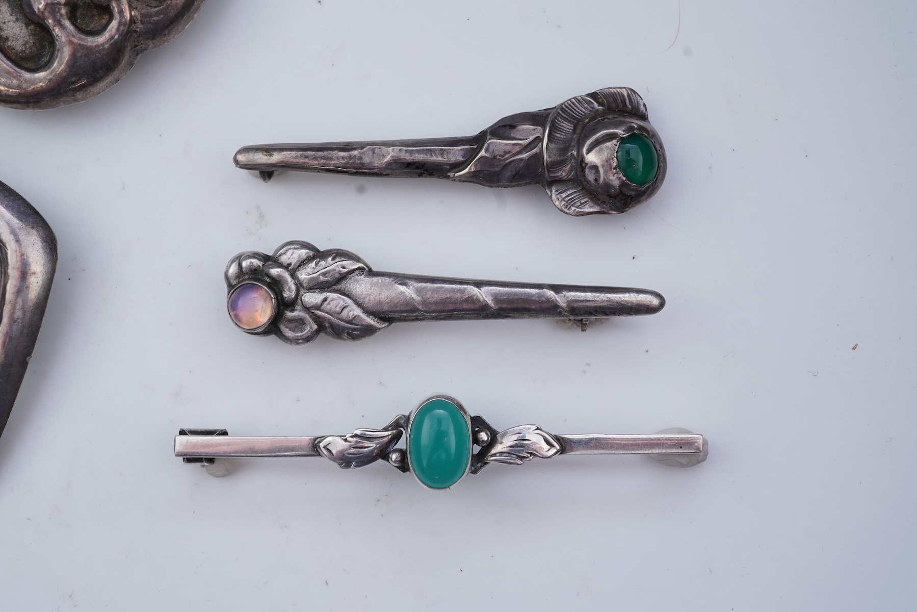 A collection of five Arts & Crafts silver brooches, Denmark, early-mid 20th century